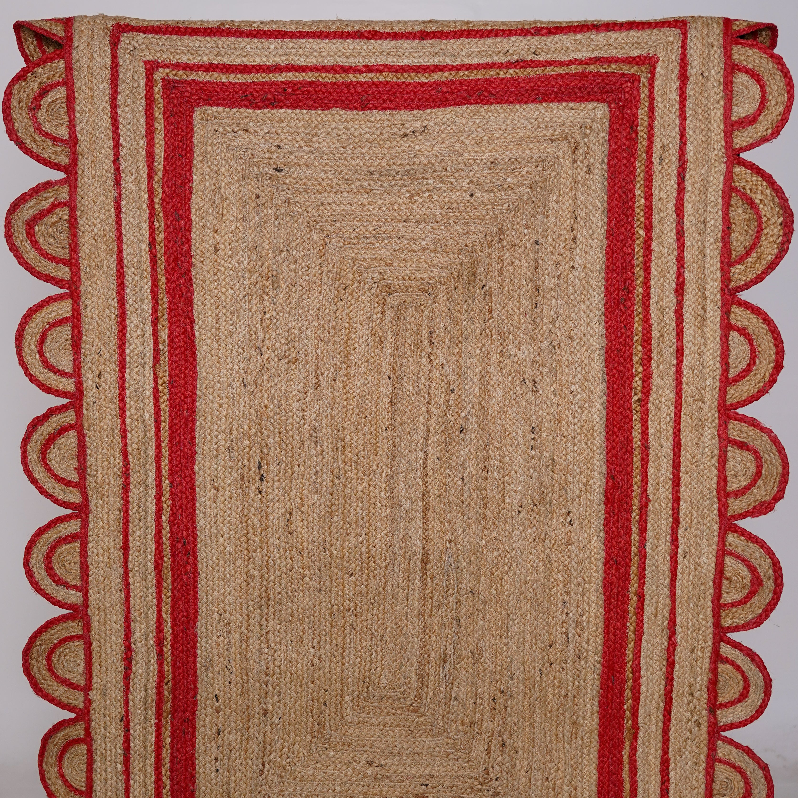 Handcrafted Scalloped Hemp Area Rug with Red Trim – Natural Charm for Modern Spaces