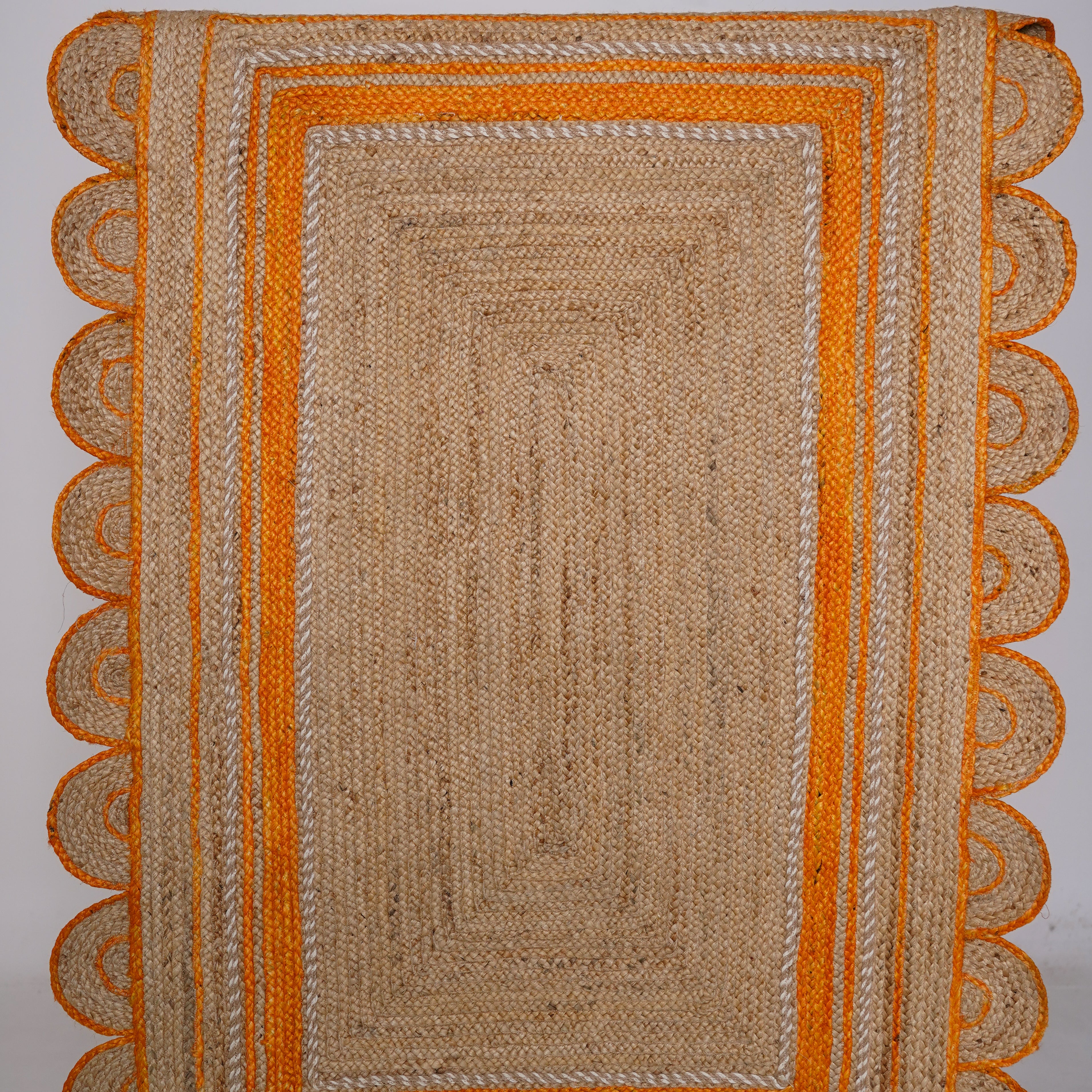 Handcrafted Scalloped Hemp Rug with Vibrant Orange Trim – Natural Elegance